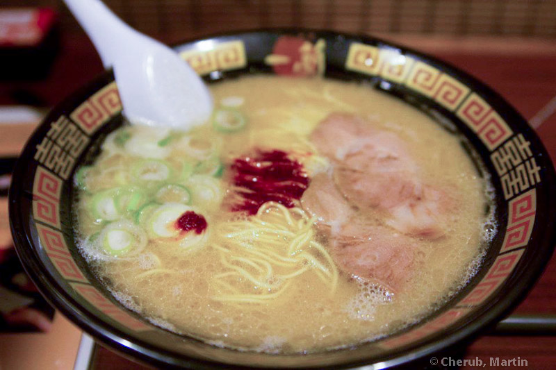 Ichiran tonkotsu ramen — rich broth, thin noodles, chashu, scallions, and the signature red chilli sauce