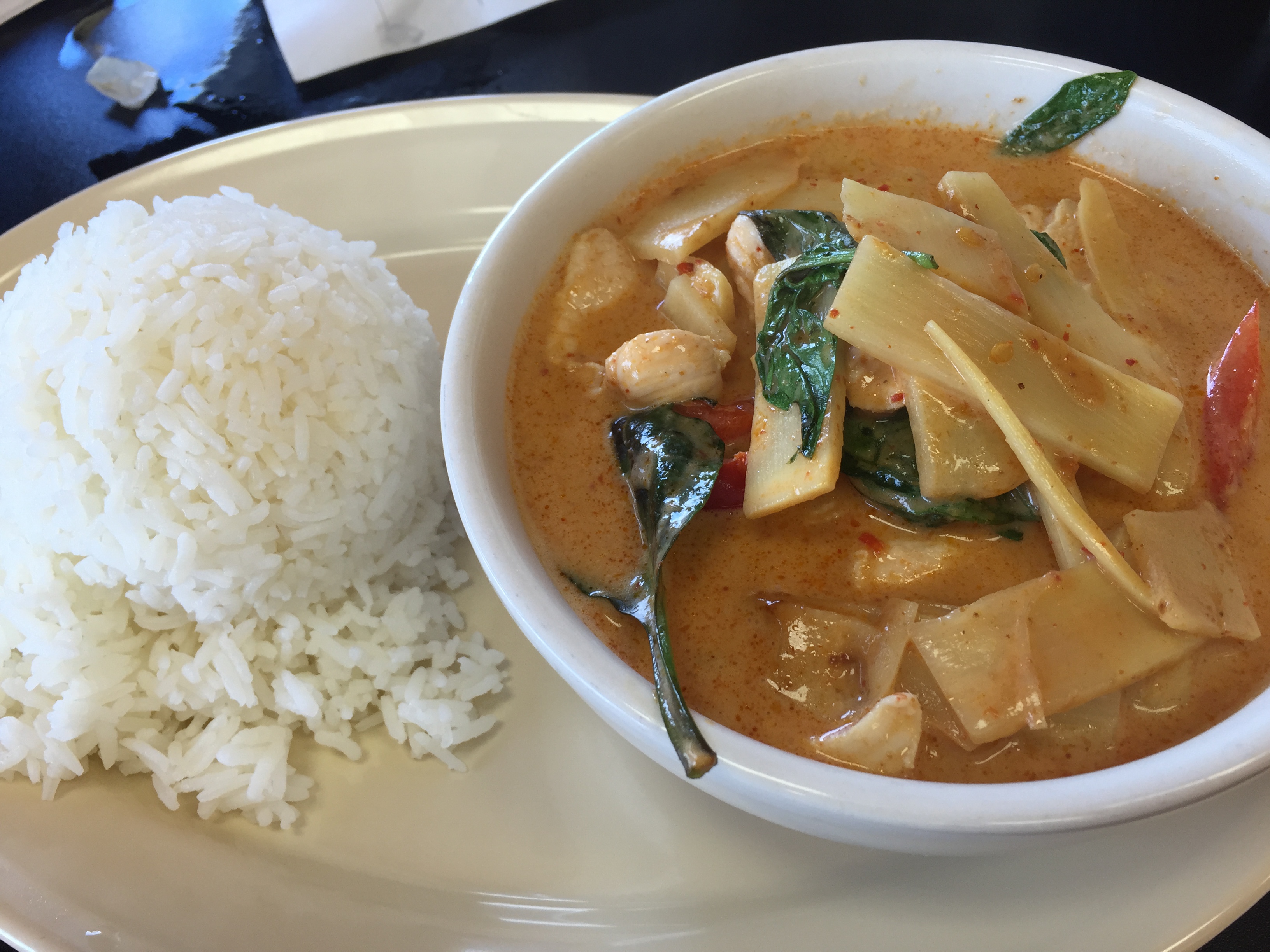 Red curry with bamboo shoots, basil, chicken, and jasmine rice