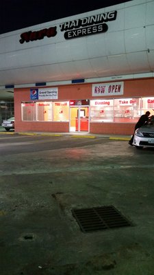 Nara Thai storefront at night — strip mall signage