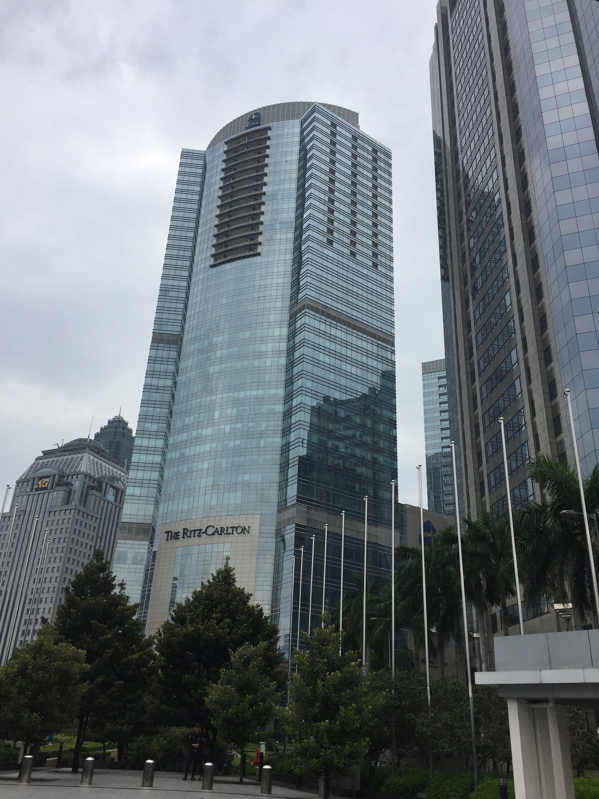 The Ritz-Carlton Jakarta tower from street level — glass and steel facade in the Sudirman financial district