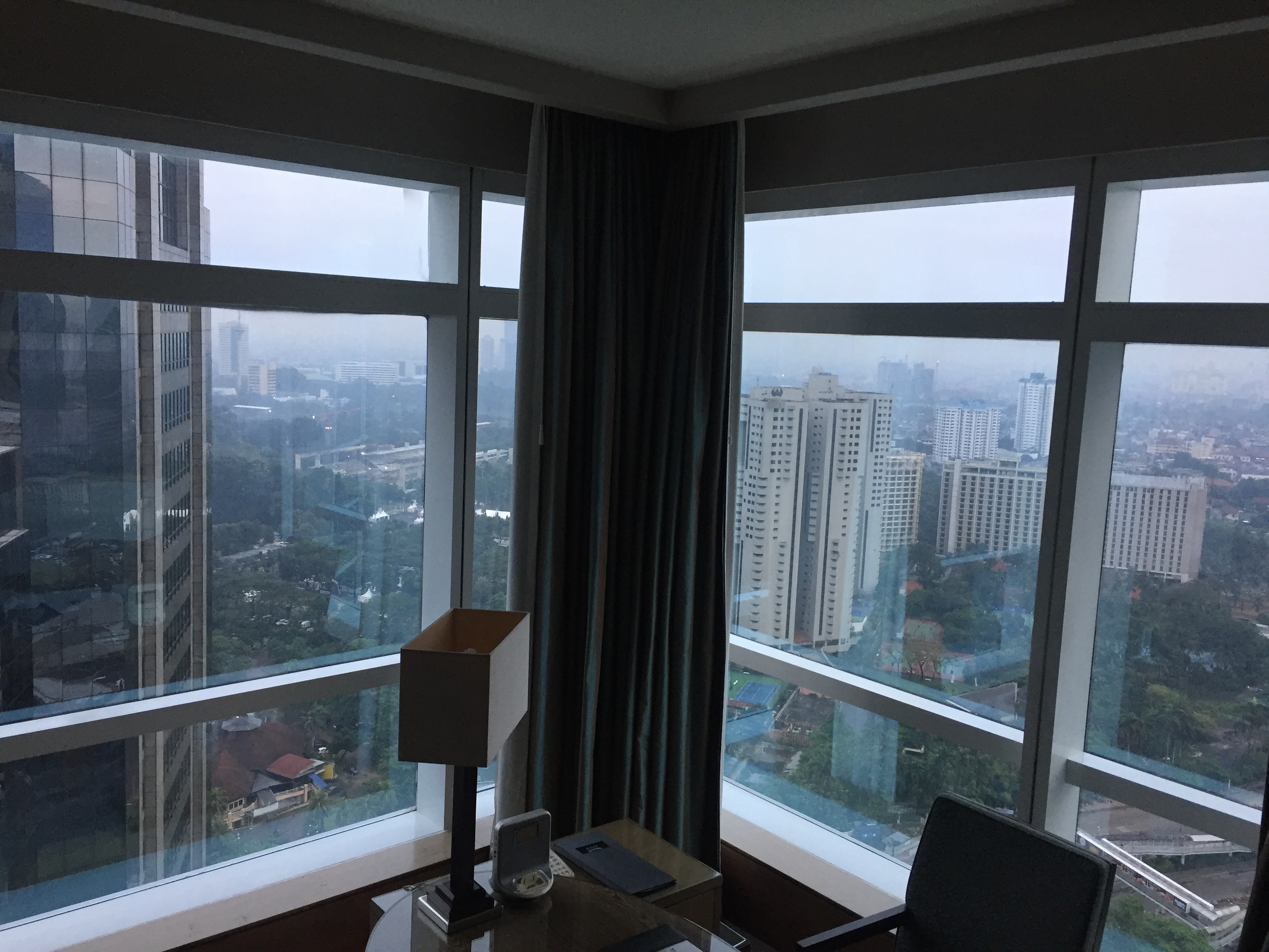 A chocolate fountain in full flow with cookies, marshmallows, and fruit on skewers ready for dipping