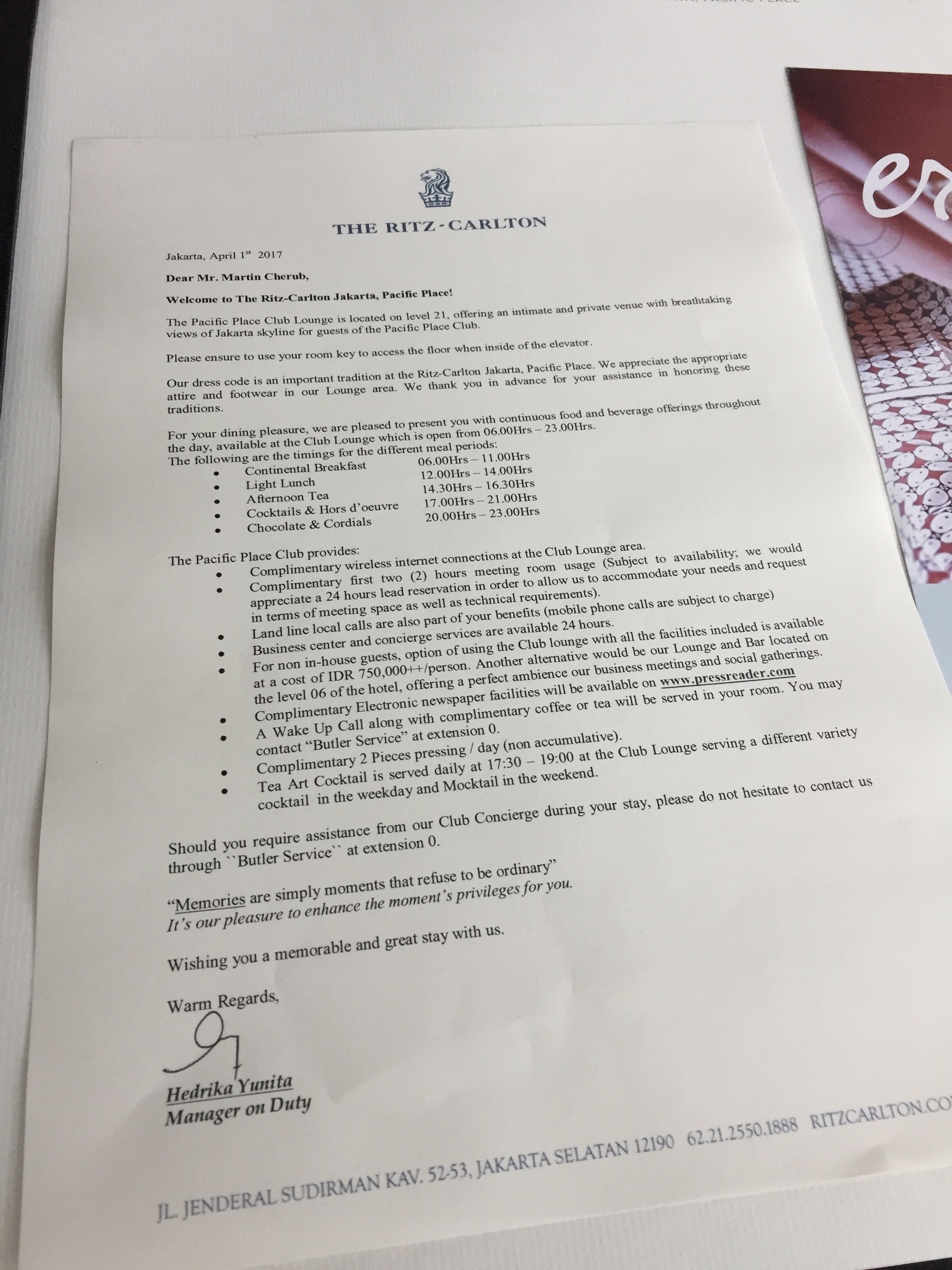 Welcome letter from the Manager on Duty on Ritz-Carlton letterhead, detailing the Pacific Place Club Lounge schedule and amenities