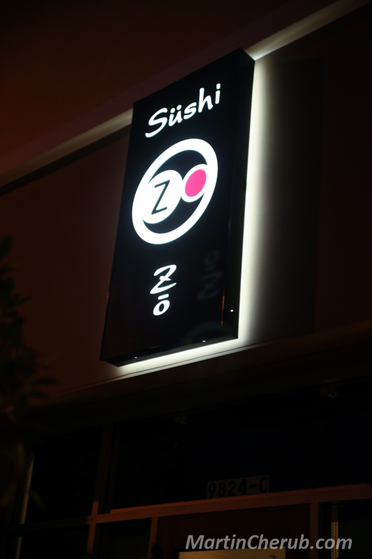 The Sushi Zo sign lit up at night
