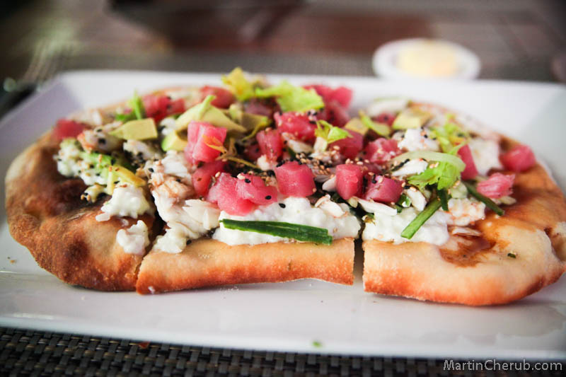 Sushi pizza topped with tuna, avocado, and crab at JW Marriott LA Market
